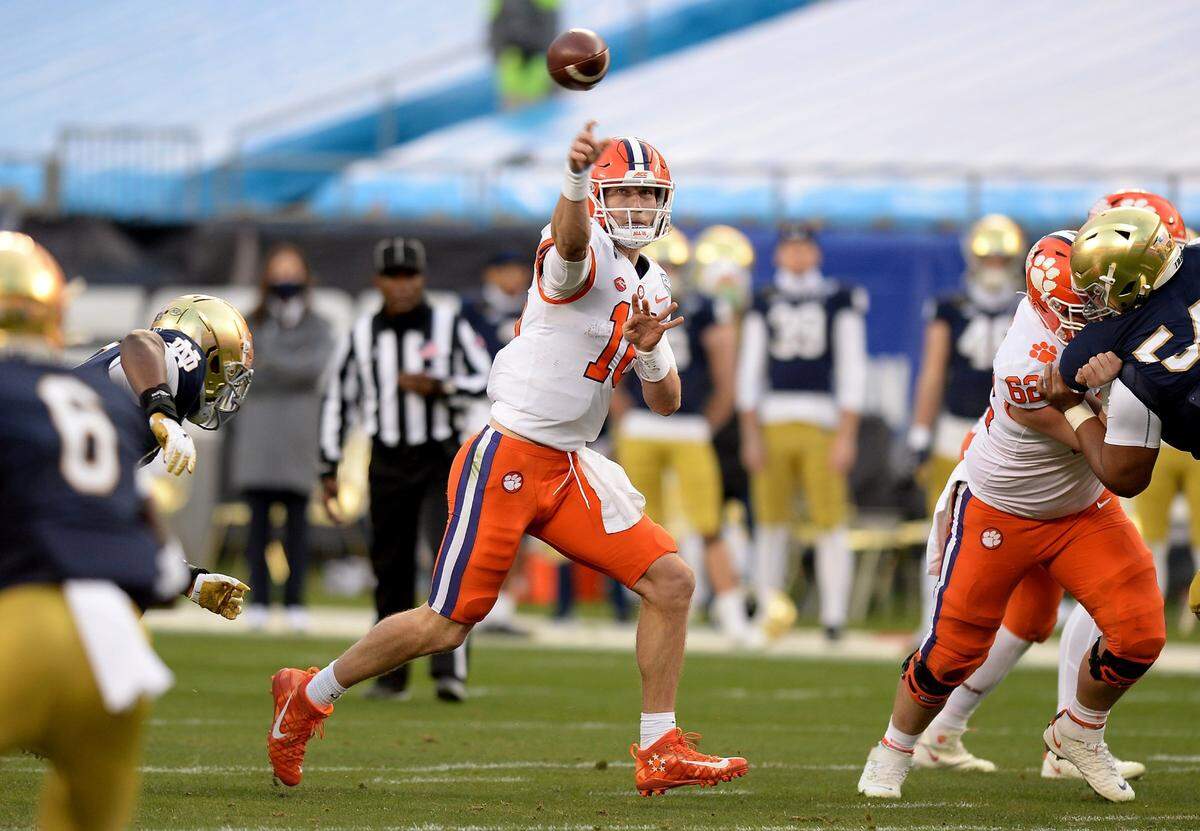 Clemson Tigers quarterback Trevor Lawrence passes to a receiver during second quarter action against Notre Dame at Bank of America Stadium on Saturday, December 19, 2020 in Charlotte, NC. The Clemson Tigers and Notre Dame Fighting Irish faced off in the ACC Championship game.