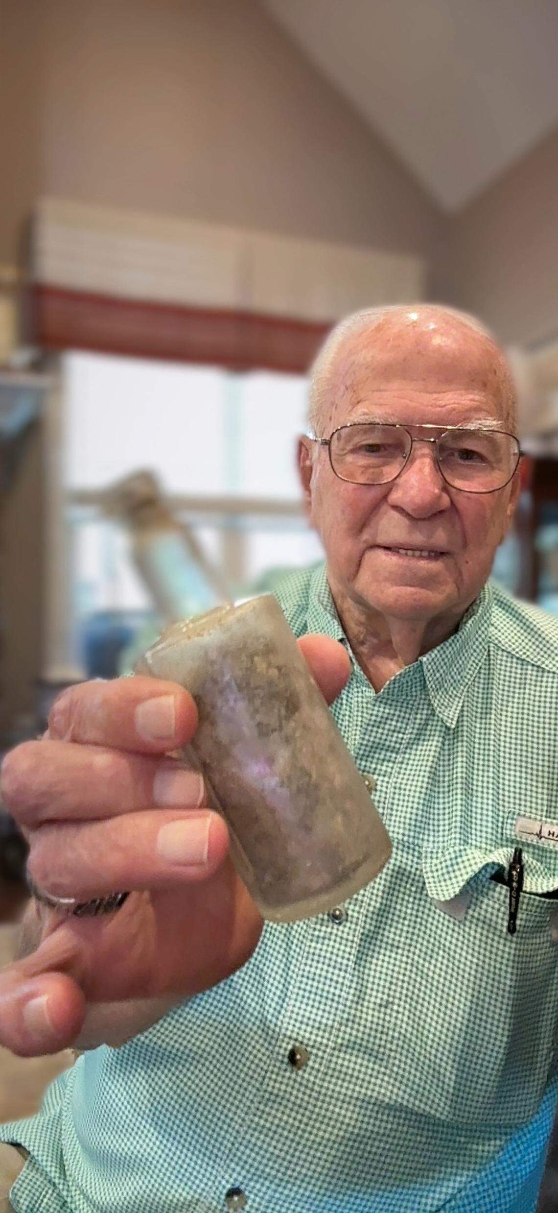 Ted Haviland shows an artifact salvaged from the City of Atlanta, the freighter his father died on when a German submarine torpedoed it off the Outer Banks in 1942.