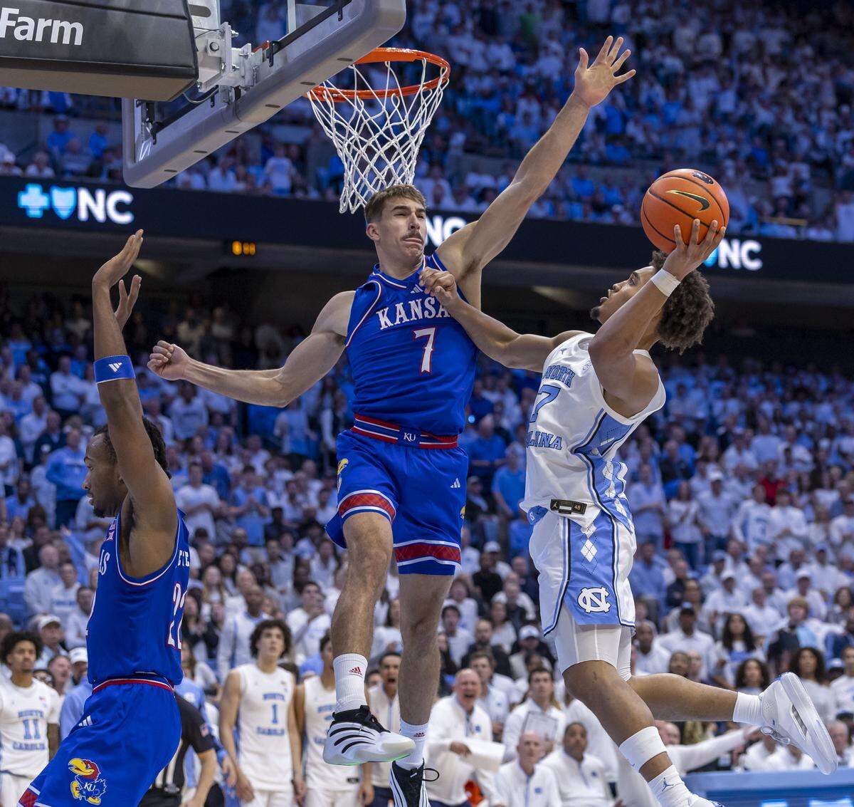 North Carolina guard Seth Trimble (7) drives to the basket against Kansas guard Kohl Rosario (7) in the second half on Friday, November 7, 2025 at the Smith Center in Chapel Hill, N.C.