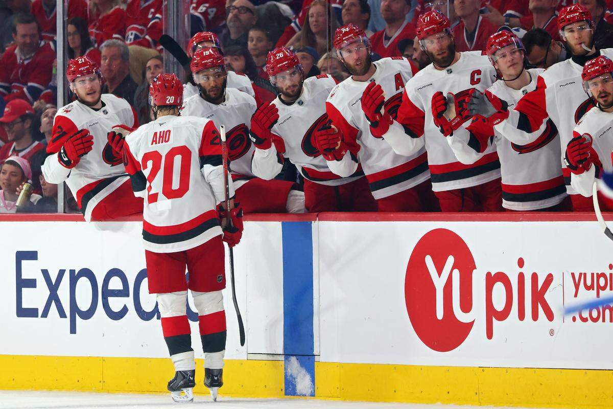 Sebastian Aho (20) of the Carolina Hurricanes celebrates with teammates after scoring a goal against the Montreal Canadiens during the first period in Game 4 of the Eastern Conference Final of the 2026 Stanley Cup Playoffs at Bell Centre on May 27, 2026 in Montreal, Quebec, Canada.