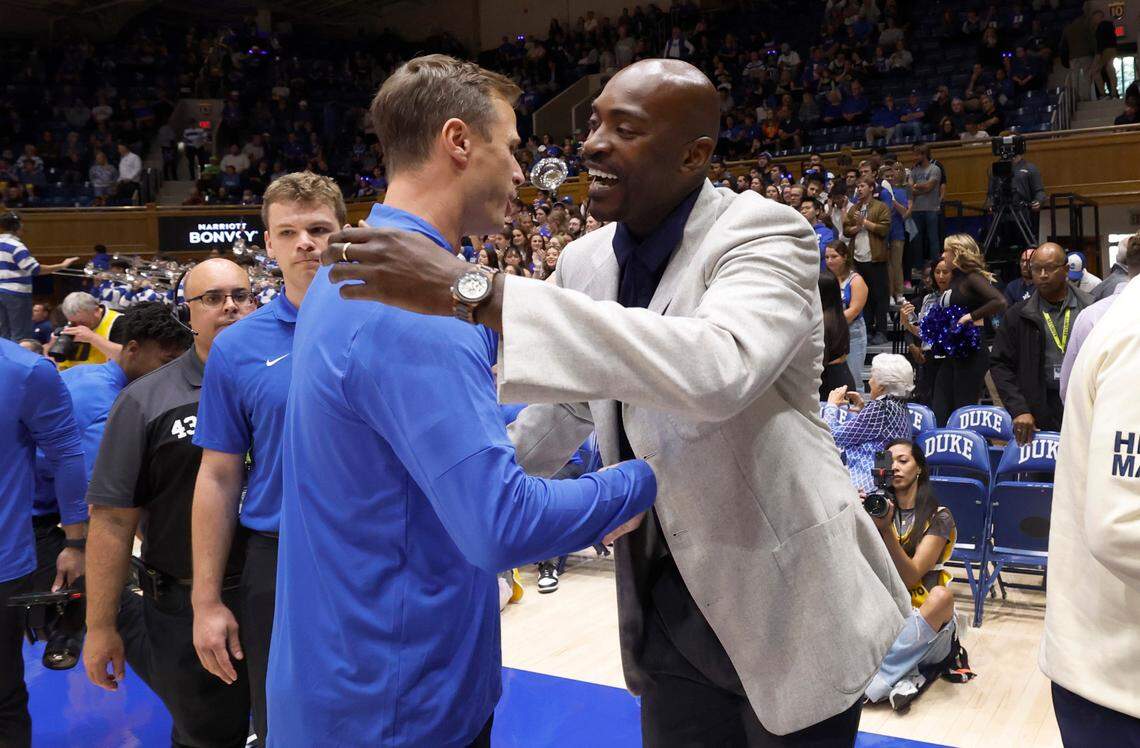 Duke head coach Jon Scheyer greets Lincoln head coach Julius Hodge, a former N.C. State basketball star, before Duke’s exhibition game against Lincoln (Pa) University at Cameron Indoor Stadium in Durham, N.C., Saturday, Oct. 19, 2024.