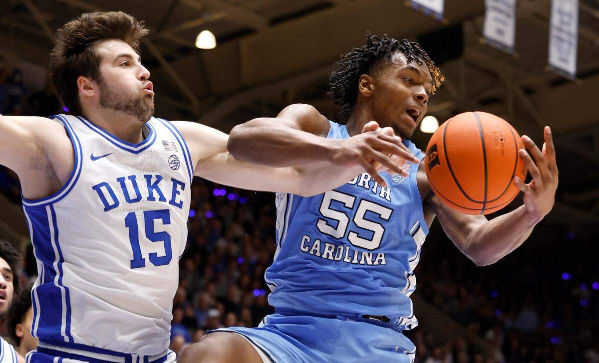 North Carolina’s Harrison Ingram (55) pulls in the rebound from Duke’s Ryan Young (15) during the first half of Duke’s game against UNC at Cameron Indoor Stadium in Durham, N.C., Saturday, March 9, 2024.