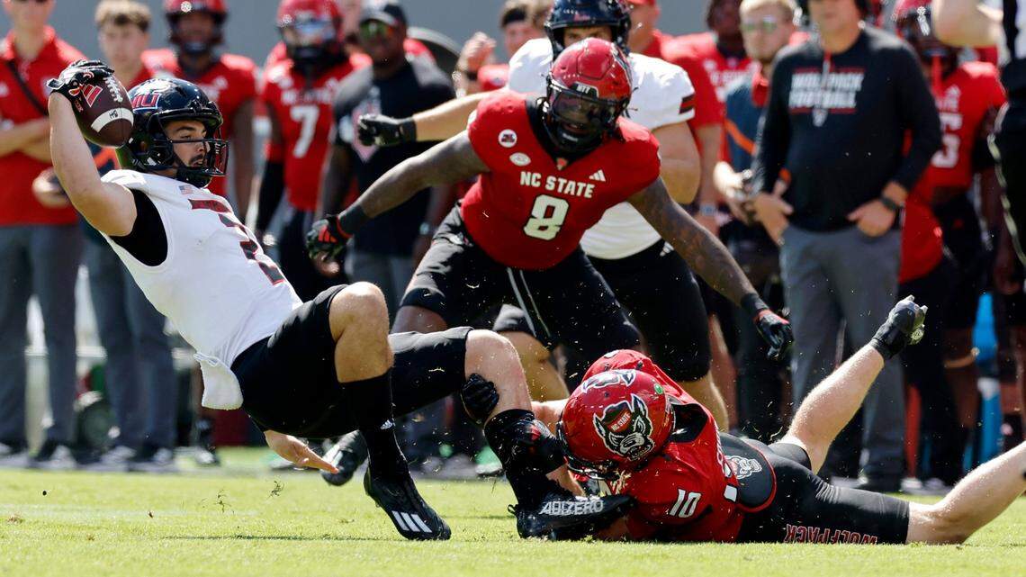 N.C. State linebacker Caden Fordham (10) tackles Northern Illinois quarterback Ethan Hampton (2) during the first half of N.C. State’s game against Northern Illinois at Carter-Finley Stadium in Raleigh, N.C., Saturday, Sept. 28, 2024.