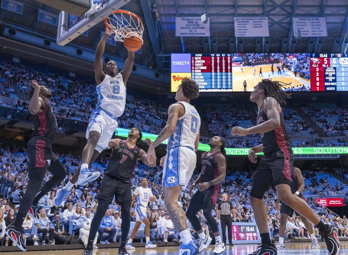 North Carolina forward Caleb Wilson (8) dunks over N.C. Central forward Khouri Carvey (7) in the first half on Friday, November 14, 2025 at the Smith Center in Chapel Hill, N.C.
