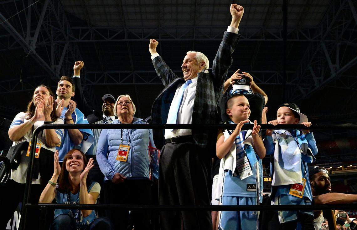 UNC head coach Roy Williams reacts with his family after the playing of “One Shining Moment as the Tar Heels beat Gonzaga 71-65 Monday, April 3, 2017 at the NCAA Final Four National Championship game in Glendale, Az. at the University of Phoenix Stadium.