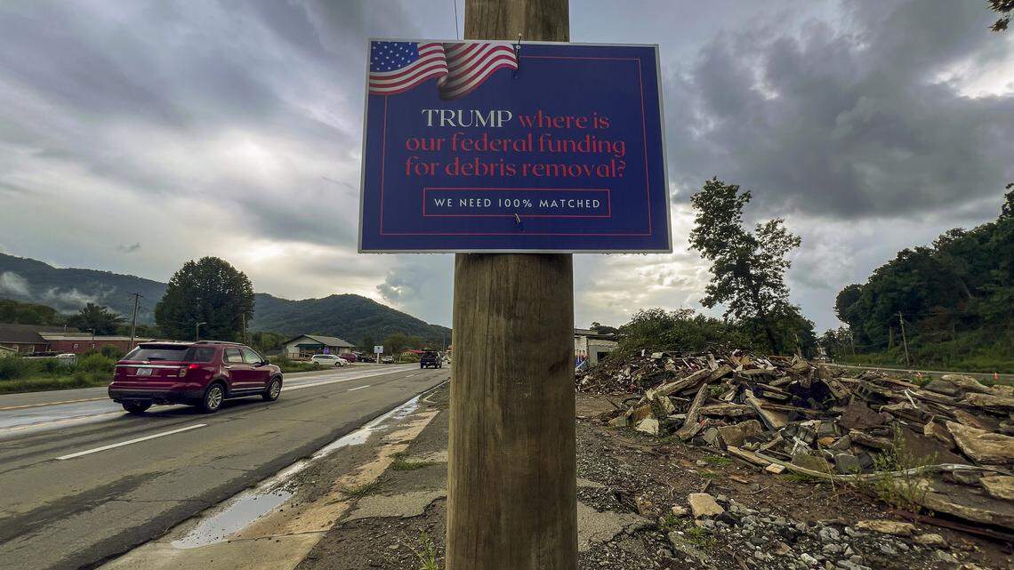 This sign on U.S. 70 in Swannanoa, photographed in August, refers to a dispute over how much FEMA should pay for Helene debris clean up in North Carolina. Initially, FEMA covered 100% of the removal costs, but it reduced its funding, despite requests from Gov. Josh Stein for the full amount. 