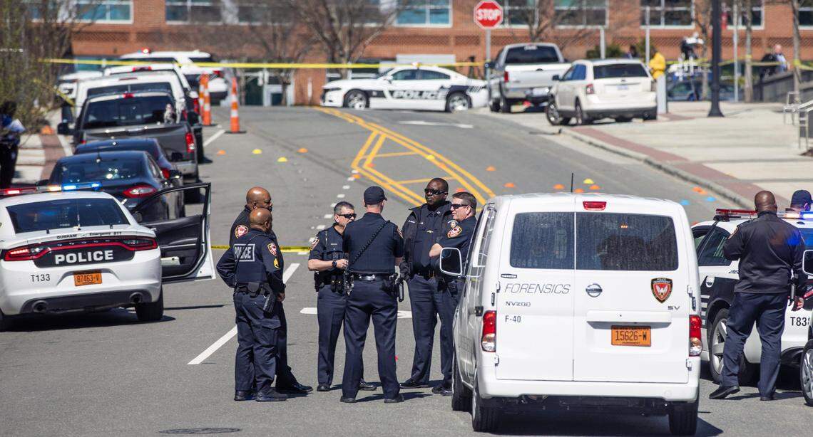 Officers investigate the scene of a shooting outside of the Durham County Courthouse where one person was wounded on Wednesday morning, Apr. 3, 2019, in Durham, NC.