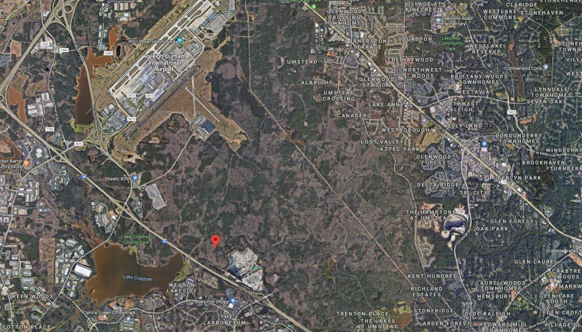 This aerial view of William B. Umstead State Park shows the Wake Stone quarry, bottom center, near the park’s Cary entrance off North Harrison Avenue. The pin marks the Raleigh-Durham International Airport property where Wake Stone hopes to expand its quarry operation.