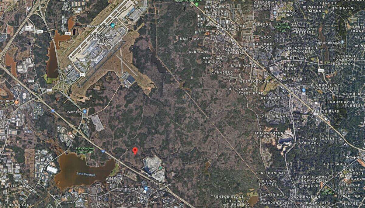 This aerial view of William B. Umstead State Park shows the Wake Stone quarry, bottom center, near the park’s Cary entrance off North Harrison Avenue. The pin marks the Raleigh-Durham International Airport property where Wake Stone hopes to expand its quarry operation.
