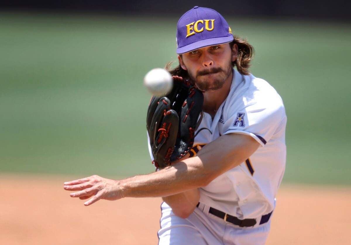 East Carolina’s C.J. Mayhue (7) pitches during ECUís game against Texas in the Greenville Super Regional at Clark-LeClair Stadium Friday, June 10, 2022.
