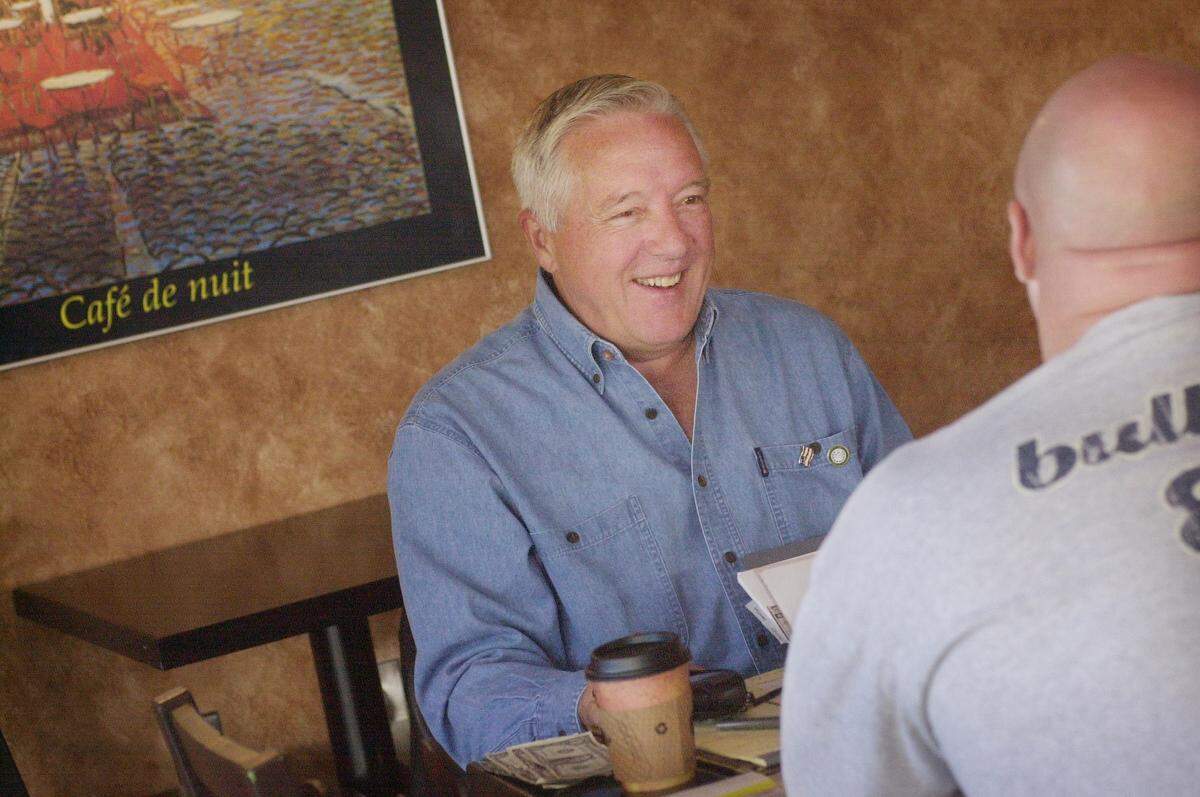 HOLLYSPRINGS.NE.111501.SV Holly Springs new mayor Richard Sears chats with Donald Best at Holly Springs Bushiban coffee shop Thursday 11/15/01 morning. “ I live in Sanford area, but my daughter comes to school here. It’s the first time I’ve met the mayor, but he seems to be a nice guy, looking out for the community,” Best says.