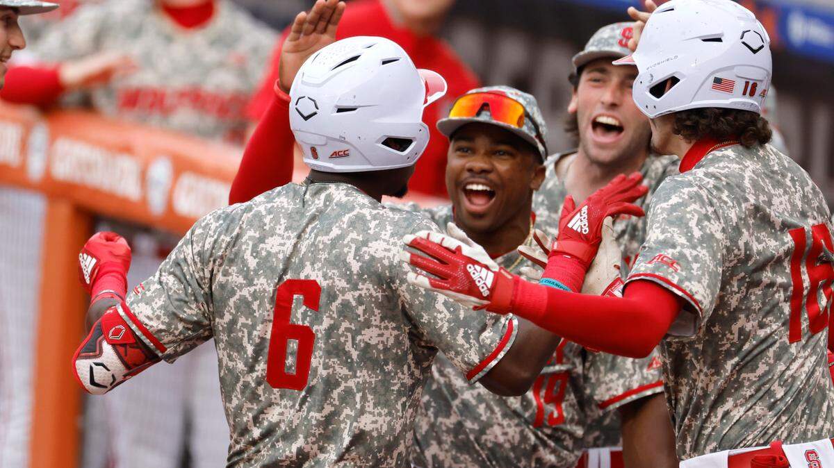N.C. State’s LuJames Groover III (6) celebrates with teammates after hitting a two-run home run in the first inning during Duke’s game against N.C. State in the ACC Baseball Championship at the Durham Bulls Athletic Park in Durham, N.C., Tuesday, May 23, 2023.