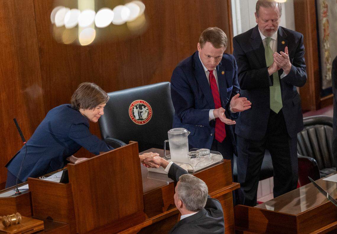 Gov. Josh Stein shakes hands with Lt. Gov. Rachel Hunt, House Speaker Destin Hall, and Senate leader Phil Berger after delivering his State of the State address to a joint session of the General Assembly on Wednesday, March 12, 2025, in the House chamber of the Legislative Building.