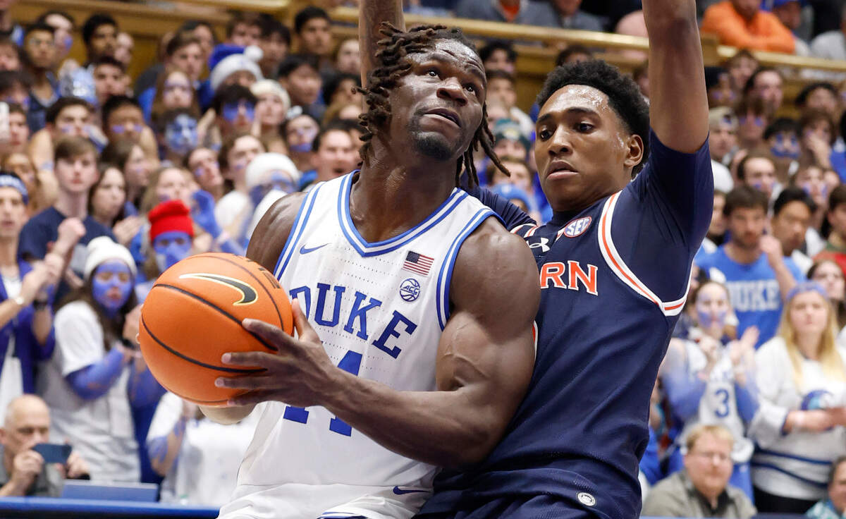Duke’s Sion James (14) drives as Auburn’s Tahaad Pettiford (0) defends during the second half of Duke’s 84-78 victory over Auburn at Cameron Indoor Stadium in Durham, N.C., Wednesday, Dec. 4, 2024.