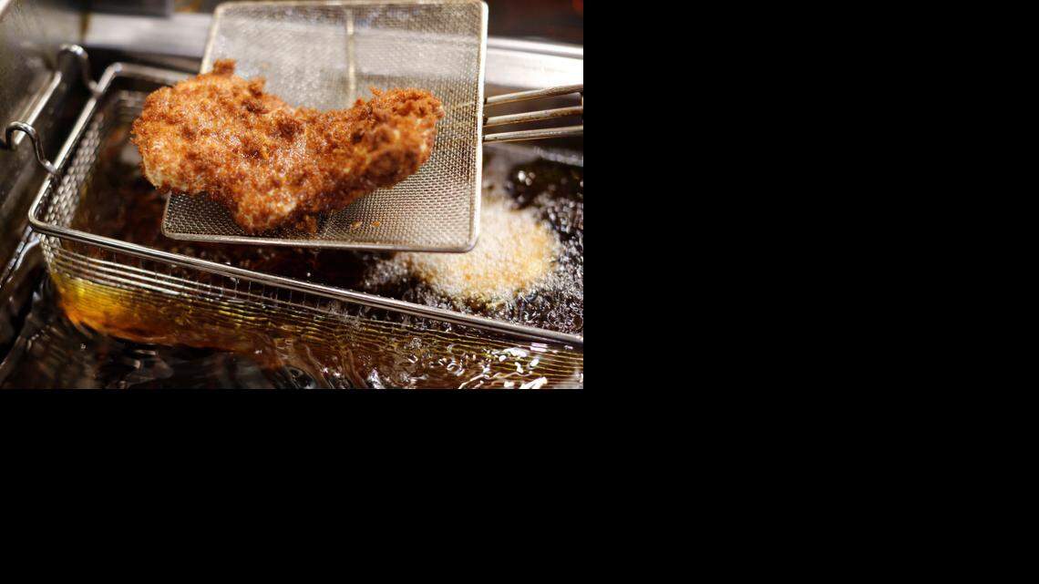 Chef Mike Lee deep fries tonkatsu made with North Carolina Silky Pork at Sono in Raleigh.
