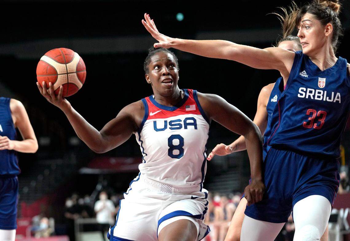 United States’ Chelsea Gray (8) drives around Serbia’s Tina Krajisnik (33) during women’s basketball semifinal game at the 2020 Summer Olympics, Friday, Aug. 6, 2021, in Saitama, Japan. The Duke graduate helped the USA team win a gold medal.