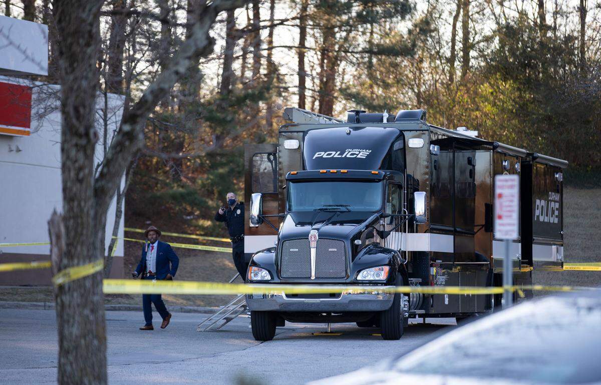 Investigators with the Durham Police Department work at the Circle K gas station near Fayetteville Road and N.C. Highway 54 in Durham, N.C. after the fatal shooting of a man by police occurred there early Wednesday morning, Jan. 12, 2022.