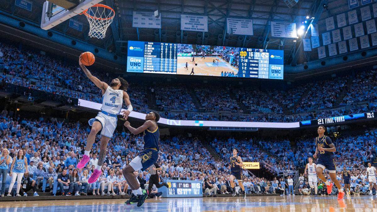 North Carolina’s R.J. Davis (4) breaks to the basket as Notre Dame’s Markus Burton (3) trails following a steal during their game in March 2024 at the Smith Center in Chapel Hill, N.C.