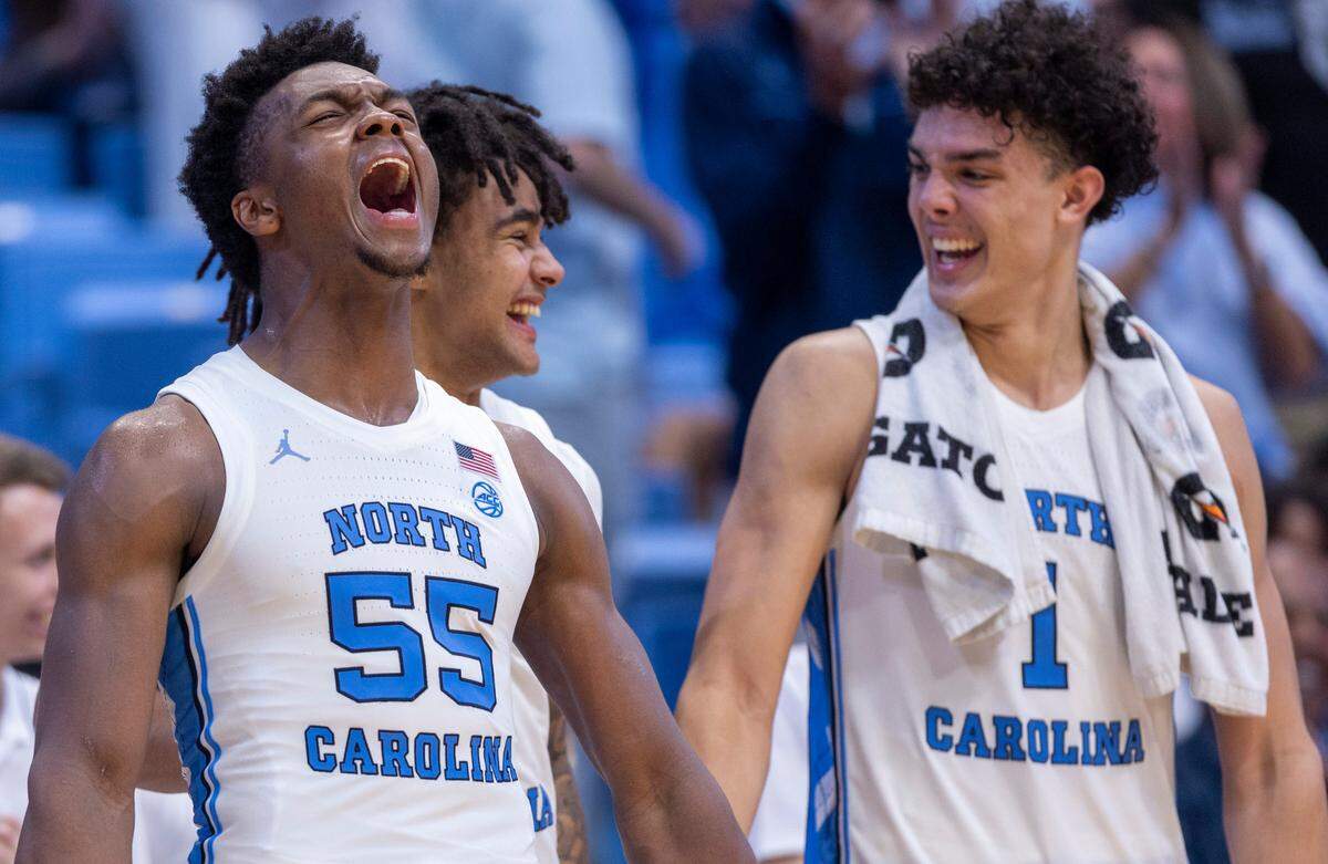 North Carolina’s Harrison Ingram (55) lets out a yell after a dunk by teammate James Okonkwo (32) to give the Tar Heels’ a 117-53 victory against St. Augustine’s on Friday, October 27, 2023 at the Smith Center in Chapel Hill, N.C.