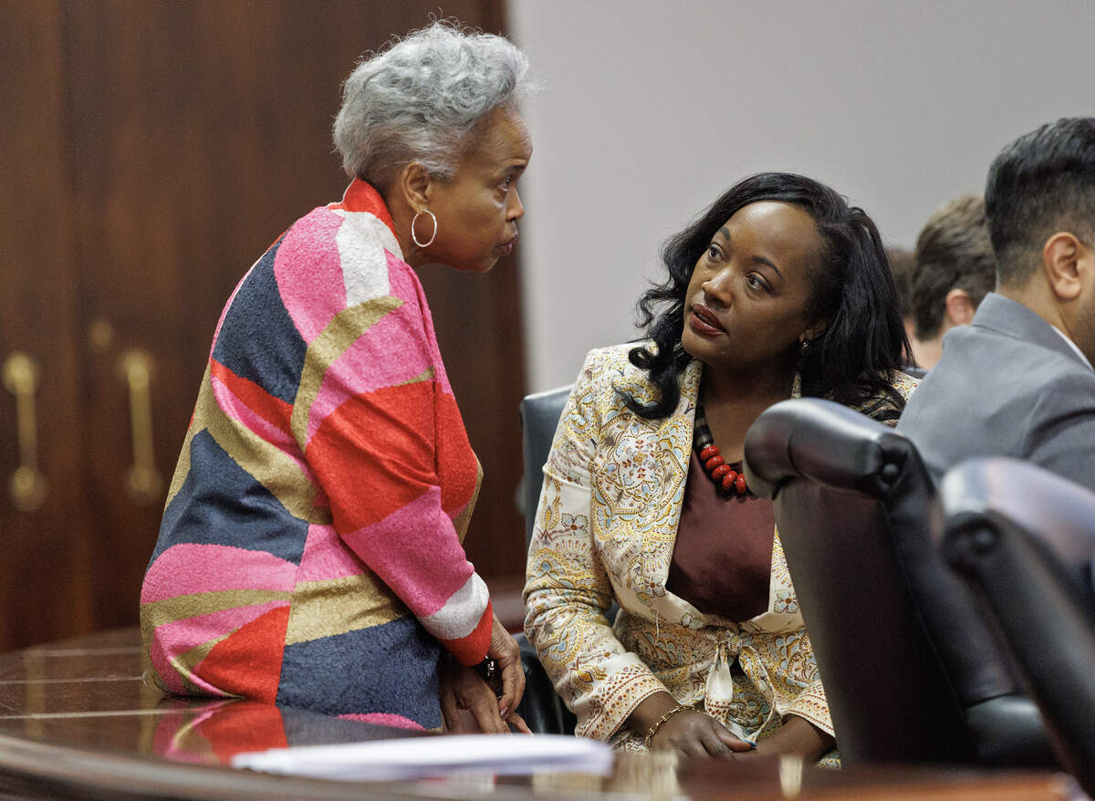 Sen. Gladys Robinson speaks with Sen. Natalie Murdock during a Senate session at the Legislative Building on Wednesday, July 1, 2026, in Raleigh, N.C.