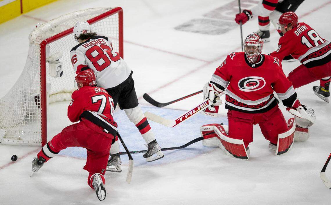 The Carolina Hurricanes Brady Skjei (76 ) defends the New Jersey Devils Jack Hughes (86) as he works to rebound the puck in the second period during Game 5 of their second round Stanley Cup playoff series on Thursday, May 11, 2023 at PNC Arena in Raleigh, N.C.