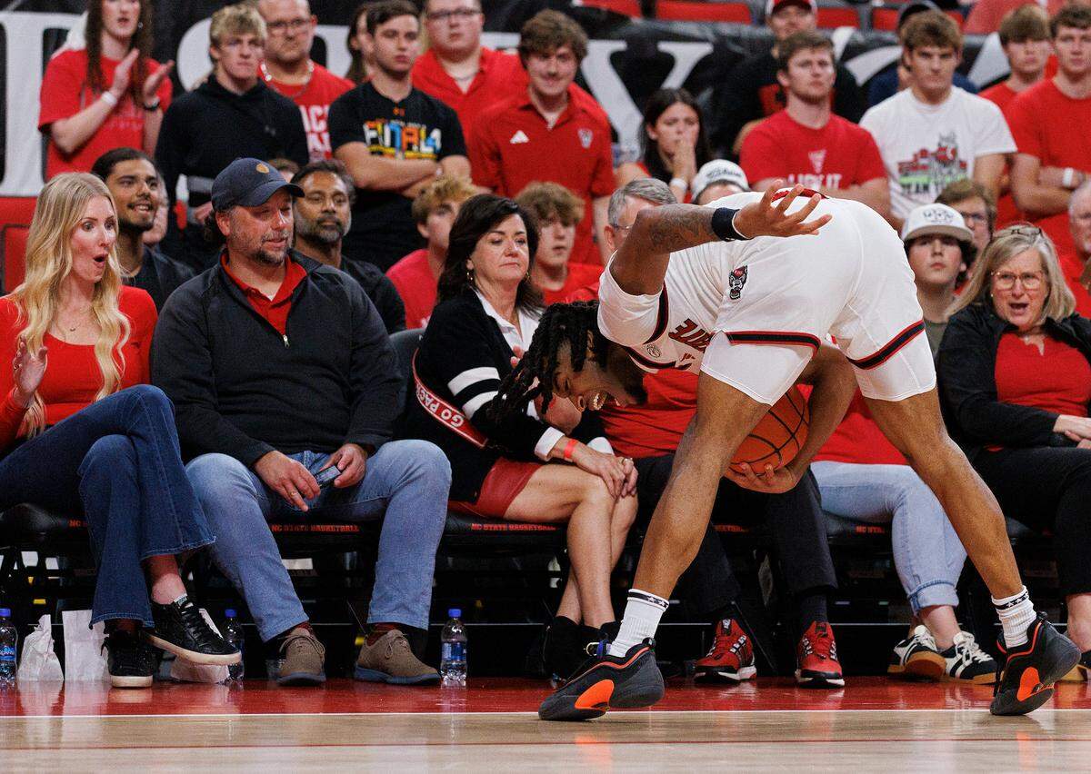 N.C. State’s Jayden Taylor attempts to keep the ball from going out of bounds during the second half of the Wolfpack’s 81-72 win over Presbyterian on Friday, Nov. 8, 2024, at Lenovo Center in Raleigh, N.C.