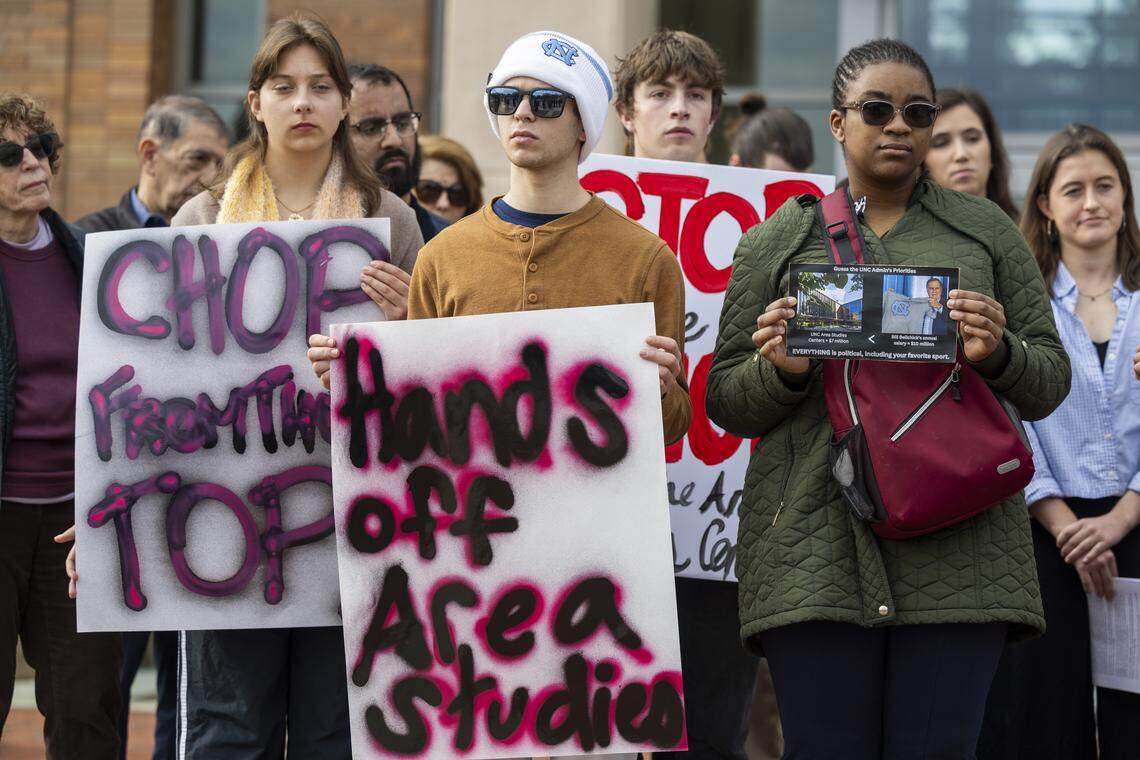 Demonstrators rally outside a UNC-Chapel Hill Board of Trustees meeting at the Spangler Center for Public Health in Chapel Hill on Thursday, Jan. 22, 2026. The board backed a surprise resolution Wednesday to cut $17 million in administrative costs, a proposal that relies in part on layoffs and further cuts to academic centers and institutes.