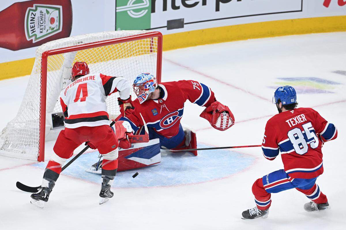 Montreal Canadiens goalie Jakub Dobes makes a save against Shayne Gostisbehere of the Carolina Hurricanes during the second period in Game 3 of the Eastern Conference Final of the 2026 Stanley Cup Playoffs at Bell Centre on May 25, 2026 in Montreal, Quebec, Canada.