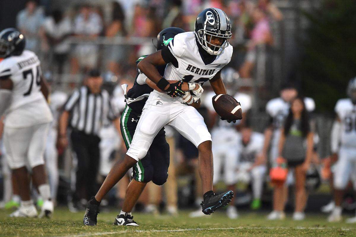 Leesville Road's Jacob Edwards (41) pushes back Heritage's  Jaylen Stokes (12) resulting in a loss of yards during the first half.  The Leesville Road Pride and the Heritage Huskies met in a  football game in Raleigh, N.C. on September 5, 2025.