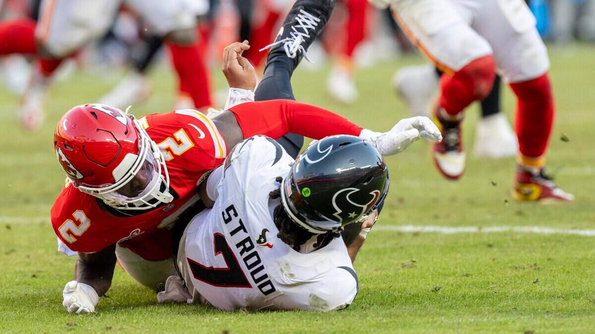 Kansas City Chiefs cornerback Joshua Williams (2) sacked Houston Texans quarterback C.J. Stroud (7) in the second half against at GEHA Field at Arrowhead Stadium on Saturday, Dec. 21, 2024.