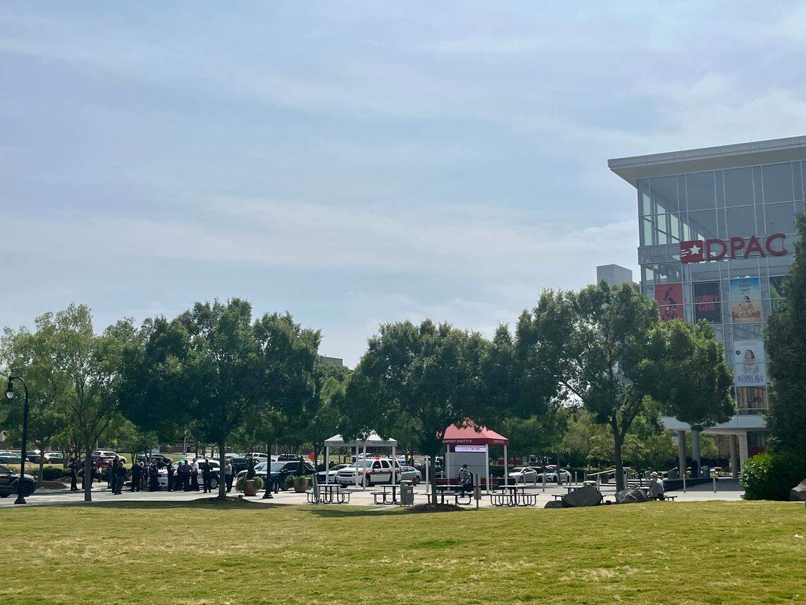 Several dozen police officers stand next to the Durham Performing Arts Center as authorities investigate a bomb threat made to the Durham County Courthouse on Friday morning.