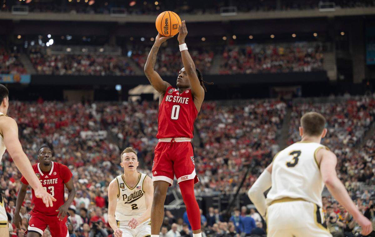 N.C. State’s D.J. Horne (0) launches a three point shot during the first half against Purdue in the NCAA Final Four National Semifinal on Saturday, April 6, 2024 at State Farm Stadium in Glendale, AZ.