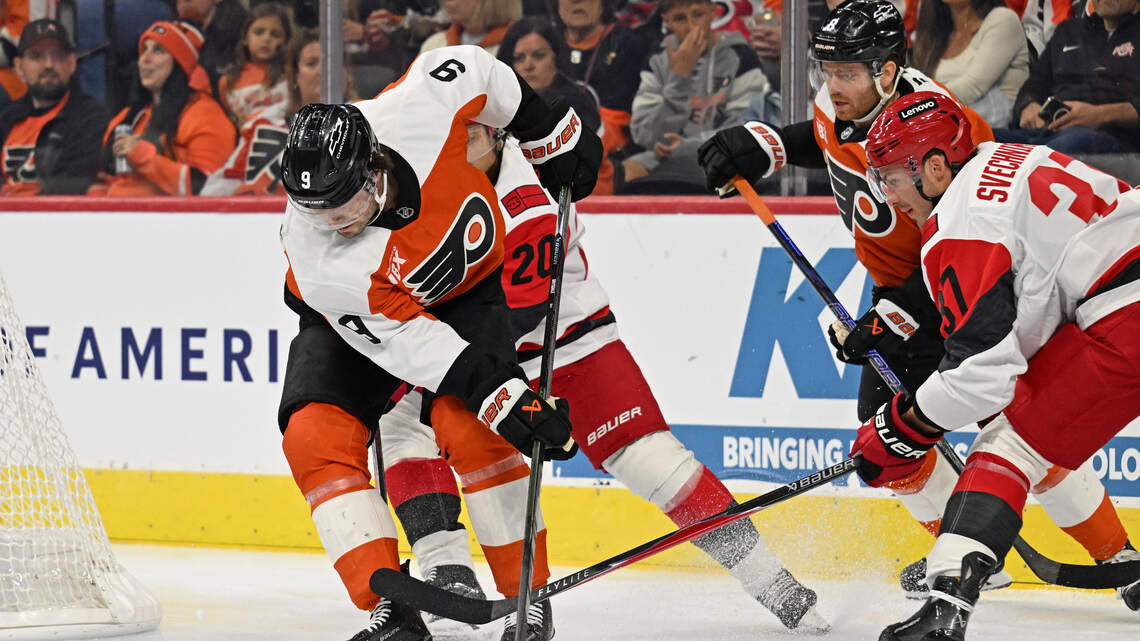 Hurricanes fight past Flyers in overtime for first win of the season