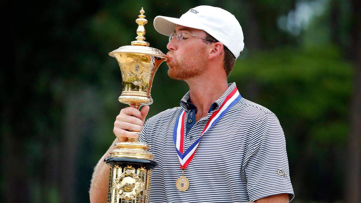 Andy Ogletree poses with the Havemeyer Trophy following his win at the USGA Amateur Golf Championship at the Pinehurst Country Club in Pinehurst, N.C., Sunday, Aug. 18, 2019. (AP Photo/Karl B DeBlaker)