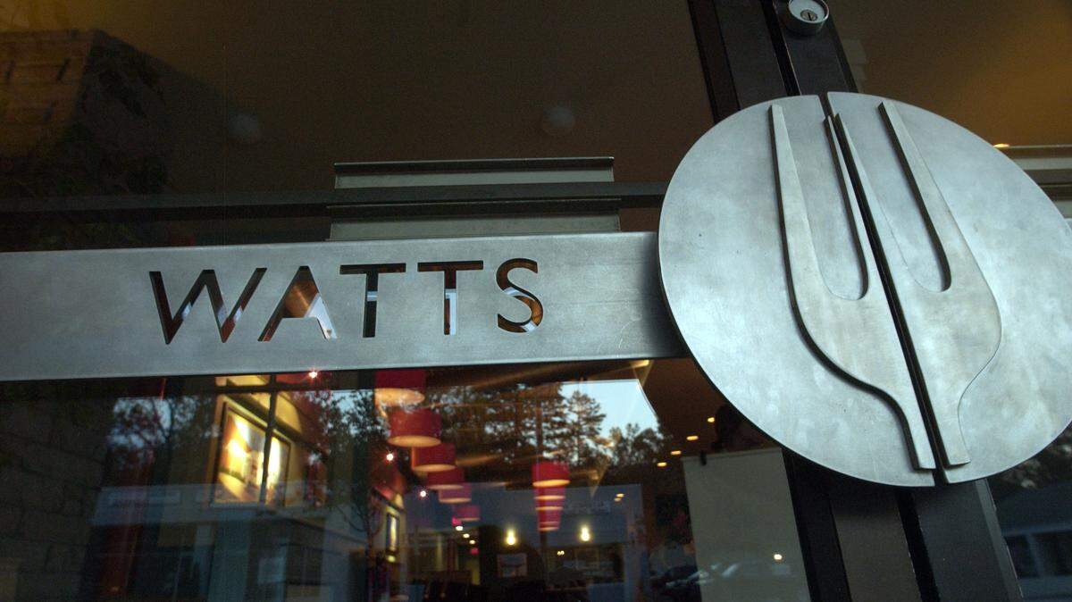 The front door to Watts Grocery has not only their name, but a huge fork that is part of the door handle.