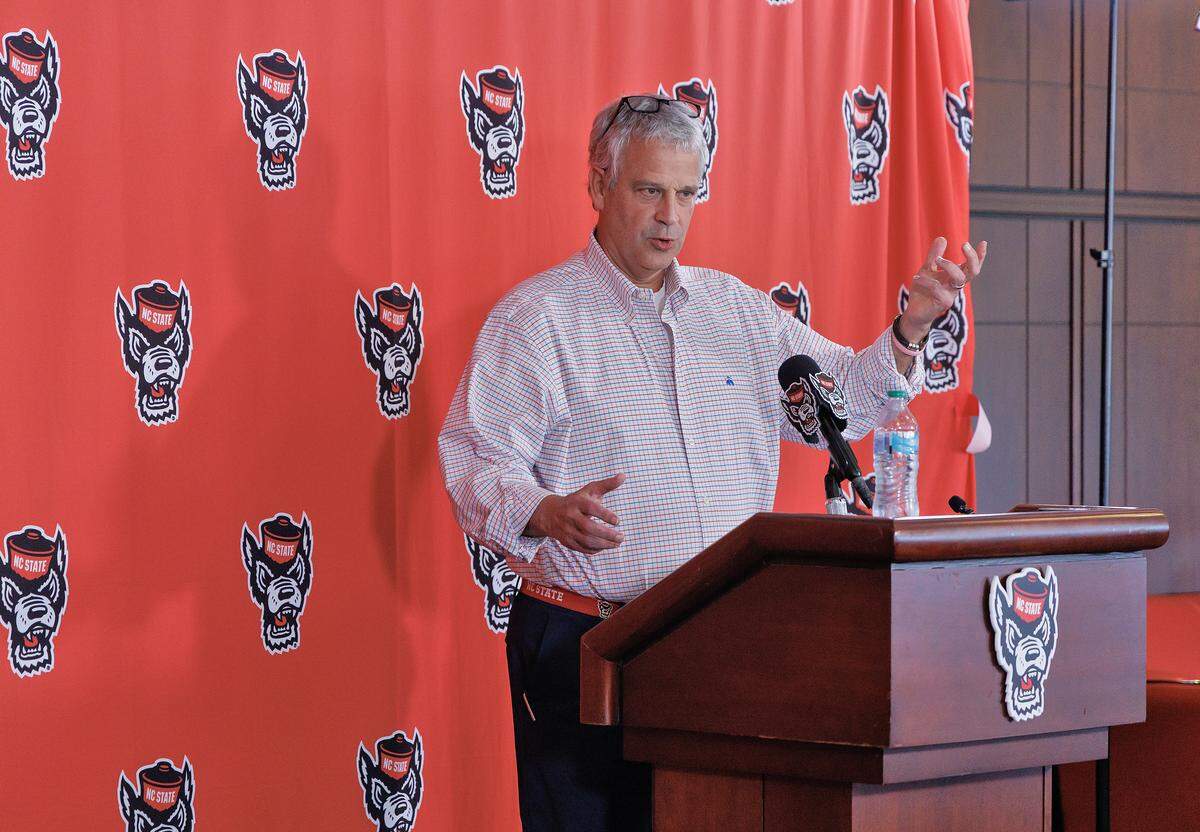 N.C. State Athletic Director Boo Corrigan speaks during a press conference at Carter-Finley Stadium on Thursday, March 26, 2026, following the departure of former men’s basketball coach Will Wade. 