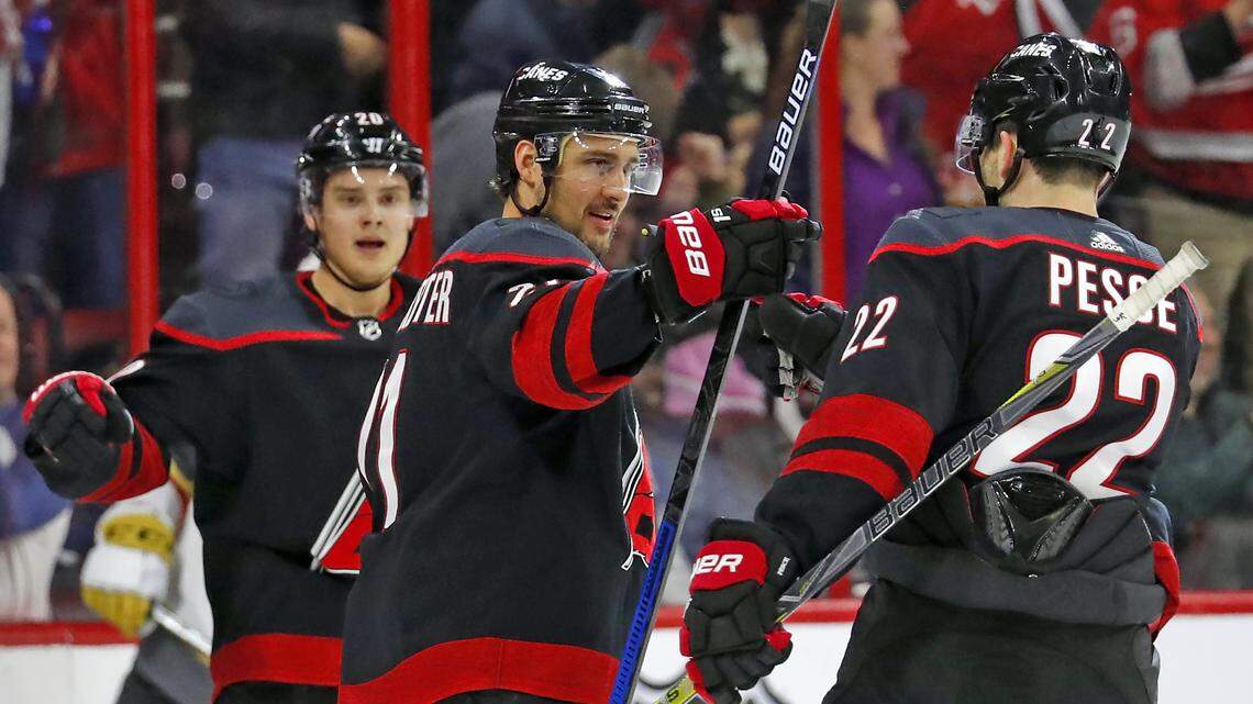 Carolina Hurricanes’ Nino Niederreiter, center, celebrates his goal with teammates Sebastian Aho, left, and Brett Pesce (22) during the first period of an NHL hockey game against the Vegas Golden Knights, Friday, Feb. 1, 2019, in Raleigh, N.C. (AP Photo/Karl B DeBlaker)