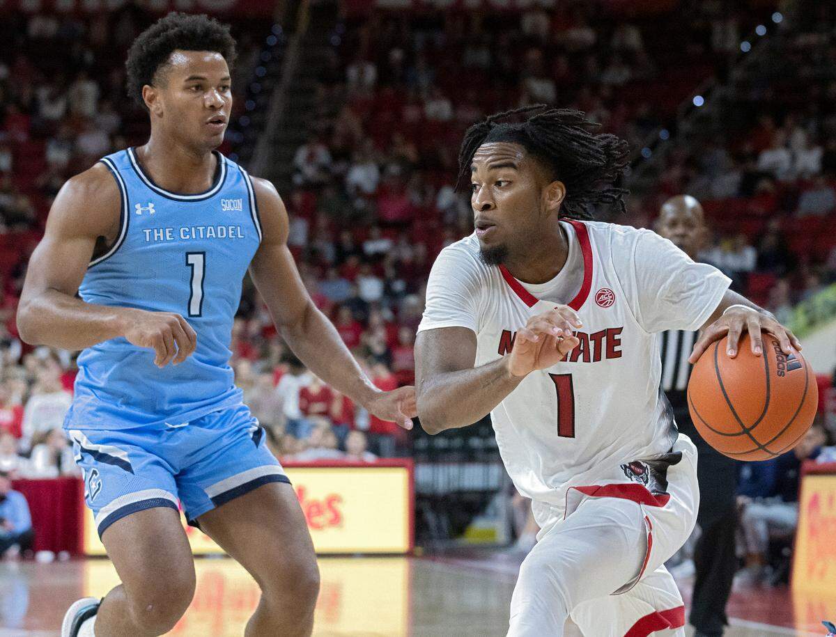 N.C. State’s Jayden Taylor drives past The Citadel’s AJ Smith during the second half of the Wolfpack’s 72-59 win on Monday, Nov. 6, 2023, at PNC Arena in Raleigh, N.C.