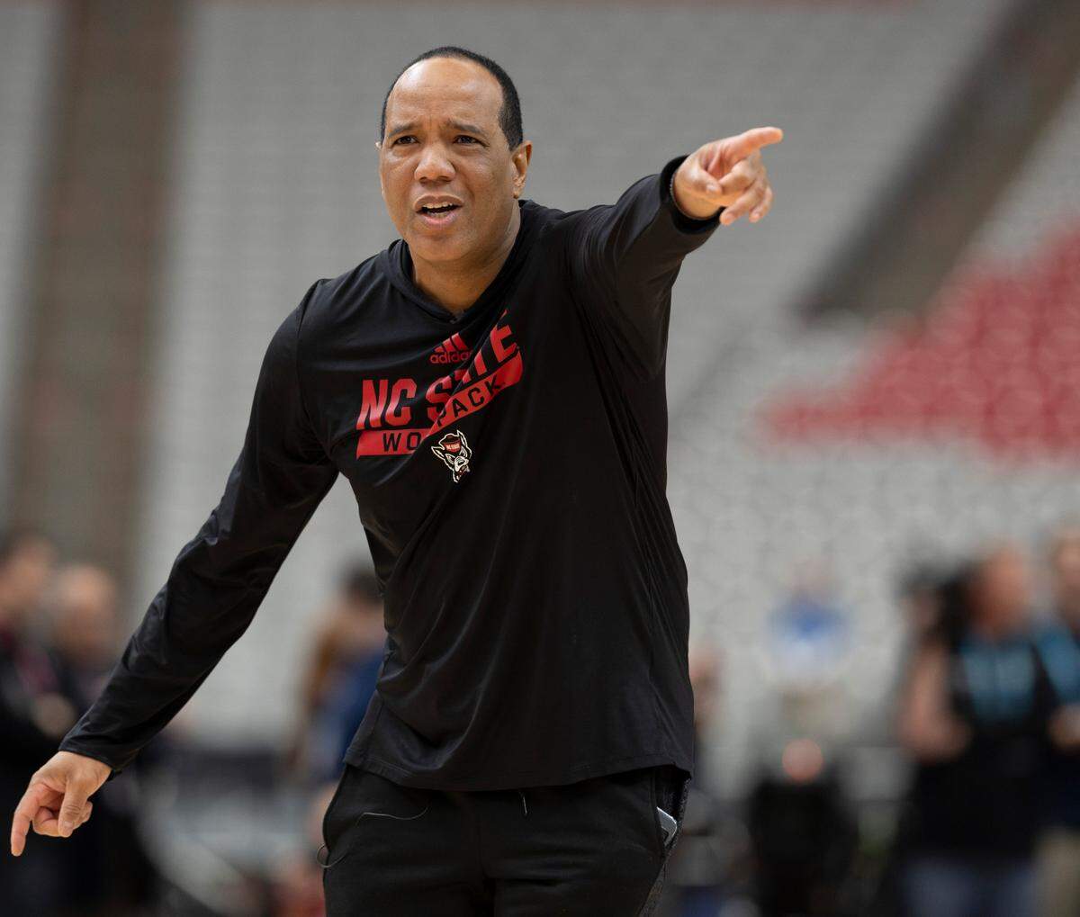 N.C. State coach Kevin Keatts directs his team during their open practice on Friday, April 5, 2024, as they prepare for their NCAA National Semi-Final game against Purdue at State Farm Stadium in Glendale, AZ.