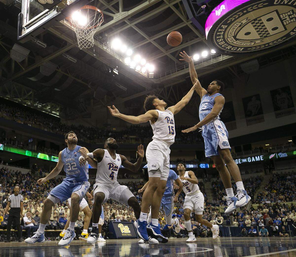 North Carolina’s Garrison Brooks (15) puts up a shot against Pitt’sKene Chukwuka (15) during the second half on Saturday, January 5, 2019 at Peterson Events Center in Pittsburgh, Pa.