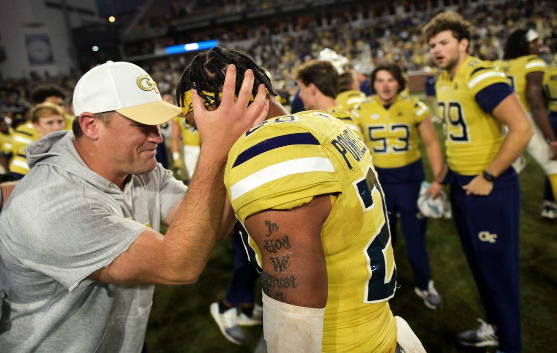 Georgia Tech interim head coach Brent Key celebrates with defensive back Clayton Powell-Lee (29) after defeating Duke 23-20 in overtime of an NCAA college football game, Saturday, Oct. 8, 2022, at Bobby Dodd Stadium, in Atlanta. (Daniel Varnado/Atlanta Journal-Constitution via AP)
