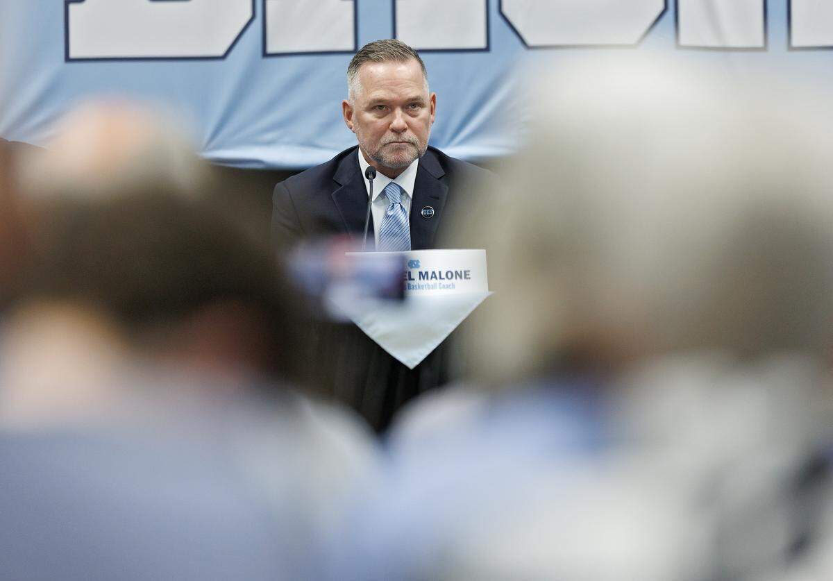 New North Carolina men’s basketball head coach Michael Malone listens to a question during a press conference at the Smith Center on Tuesday, April 7, 2026, in Chapel Hill, N.C. 