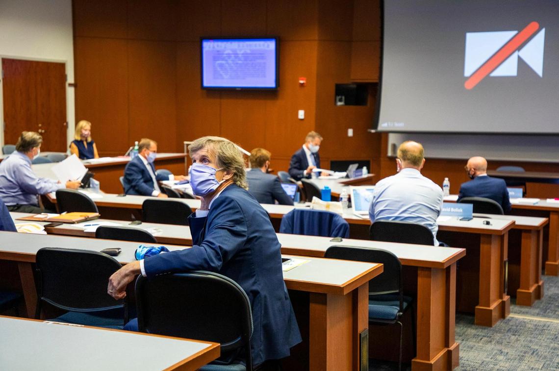 Charles Marshall, vice chancellor and general counsel for UNC Chapel Hill, turns to read a screen displaying a draft of a new policy for renaming campus buildings during a UNC Board of Trustees meeting on Thursday, July 16, 2020, in Chapel Hill, N.C.