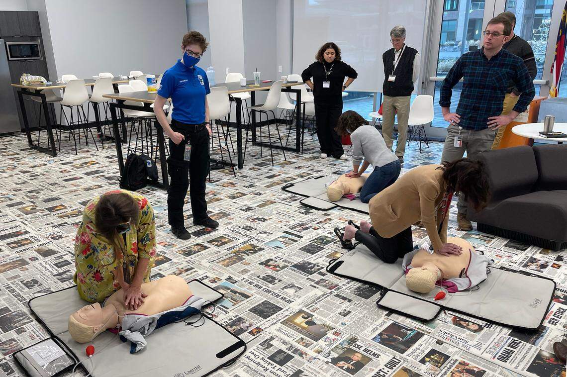 News & Observer employees participate in CPR training in the newsroom in Raleigh on Tuesday, Jan. 17, 2023.