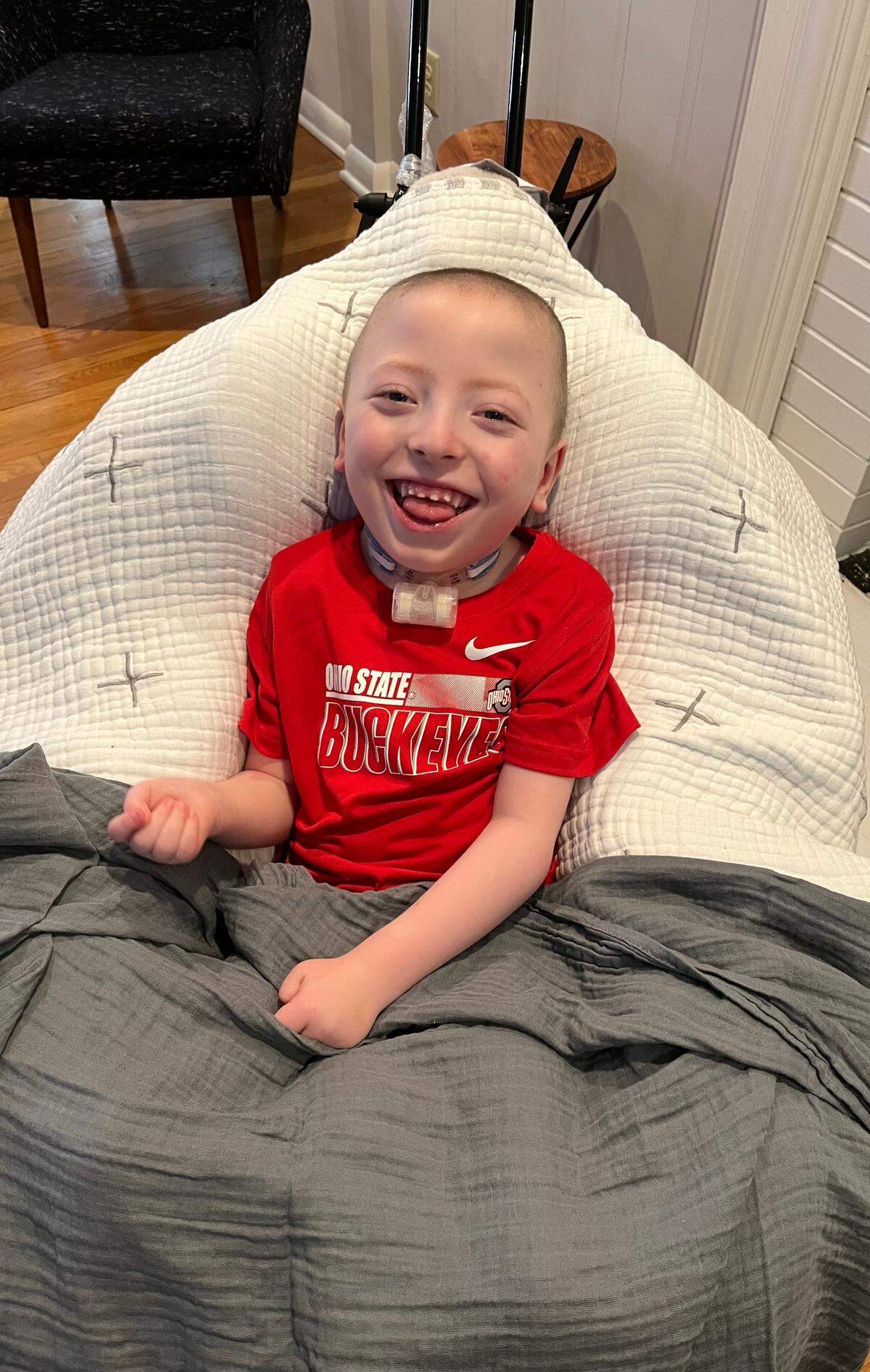 Boston Yannotti, 5, smiles for a photograph in Bexley, OH on Feb. 1, 2022, several days after having brain surgery at Nationwide Children’s Hospital to deliver gene therapy to treat a rare disease called AADC deficiency.