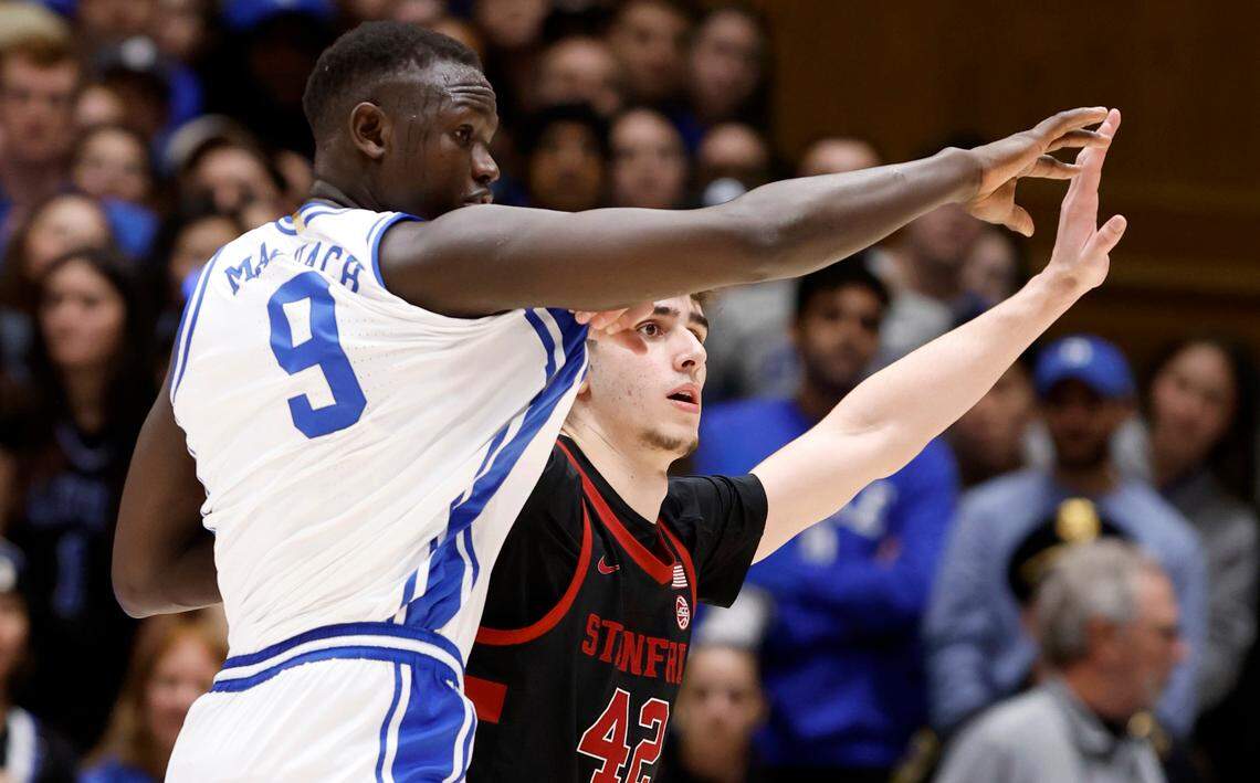 Stanford’s Maxime Raynaud (42) fights with Duke’s Khaman Maluach (9) for position during the first half of Duke’s game against Stanford at Cameron Indoor Stadium in Durham, N.C., Saturday, Feb. 15, 2025.