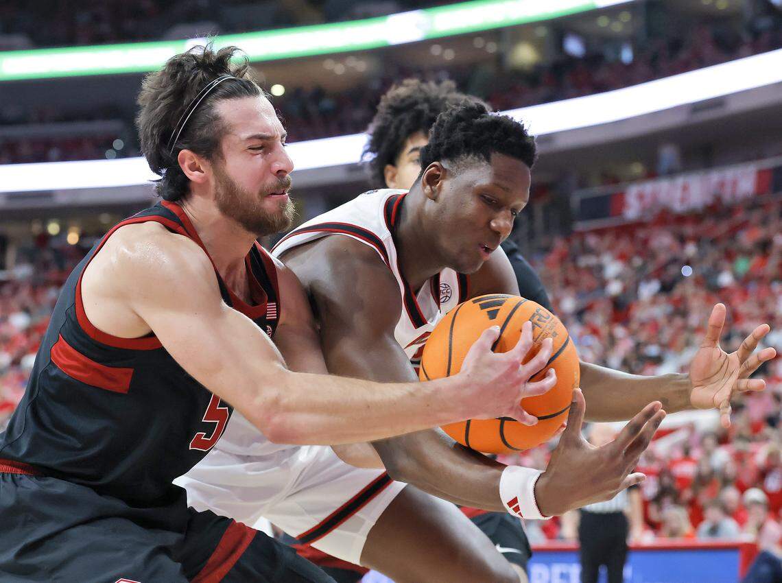 Stanford's Benny Gealer and N.C. State's Musa Sagnia battle for possession during the first half of the Wolfpack’s 85-84 loss on Saturday, March 7, 2026, at Lenovo Center in Raleigh, N.C.