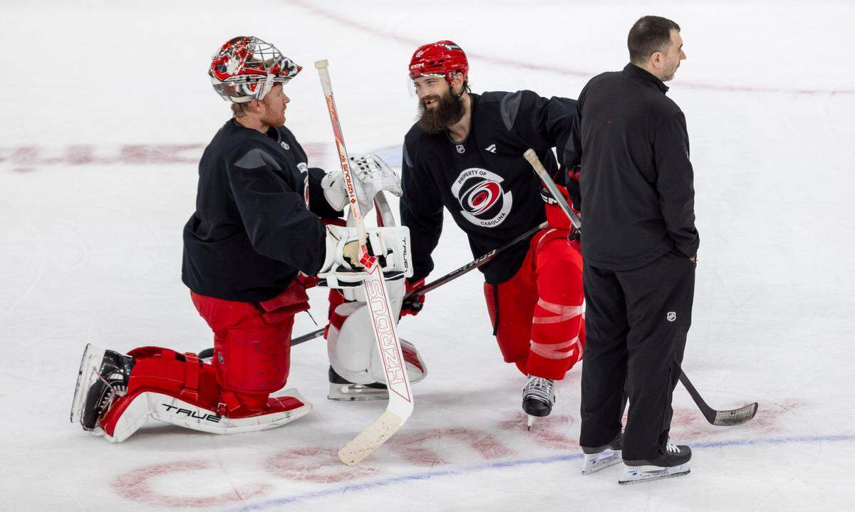 Carolina Hurricanes goalie Frederik Andersen (31) talks with defenseman Bret Burns (8) during practice on Friday, May 2, 2025 at Lenovo Center in Raleigh, N.C.