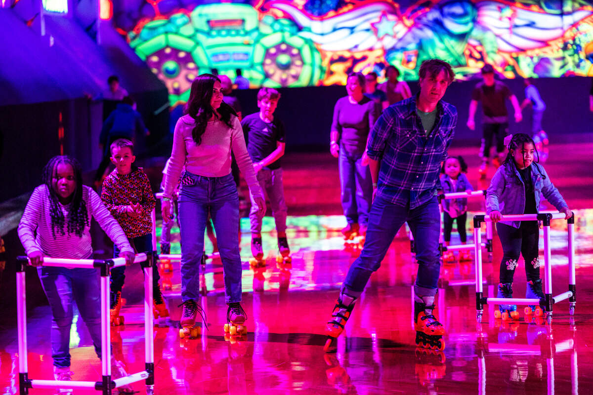 Roller-skaters circle the rink of Wheels Durham roller-skating rink on Hoover Road Friday, Feb. 28, 2025 after having been closed in 2020 after four decades. In 2021, the city bought the space and began renovations after residents demanded the return of the safe space for youth in East Durham.