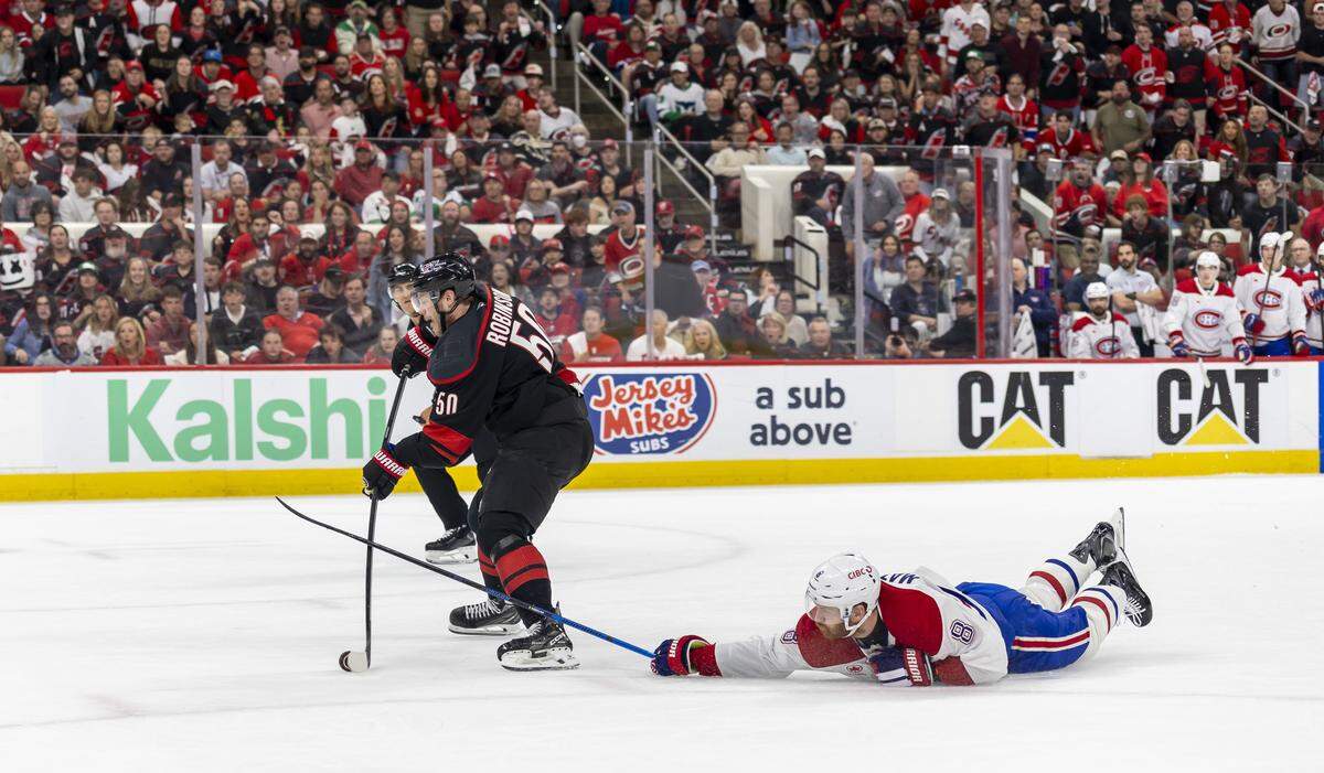 Carolina Hurricanes left wing Eric Robinson (50) breaks away from Montreal defenseman Mike Matheson (8) to score, giving the Hurricanes’ a 3-0 lead in the first period in Game 5 of the Eastern Conference Finals against Montreal on Friday, May 29, 2026 at Lenovo Center in Raleigh, N.C.